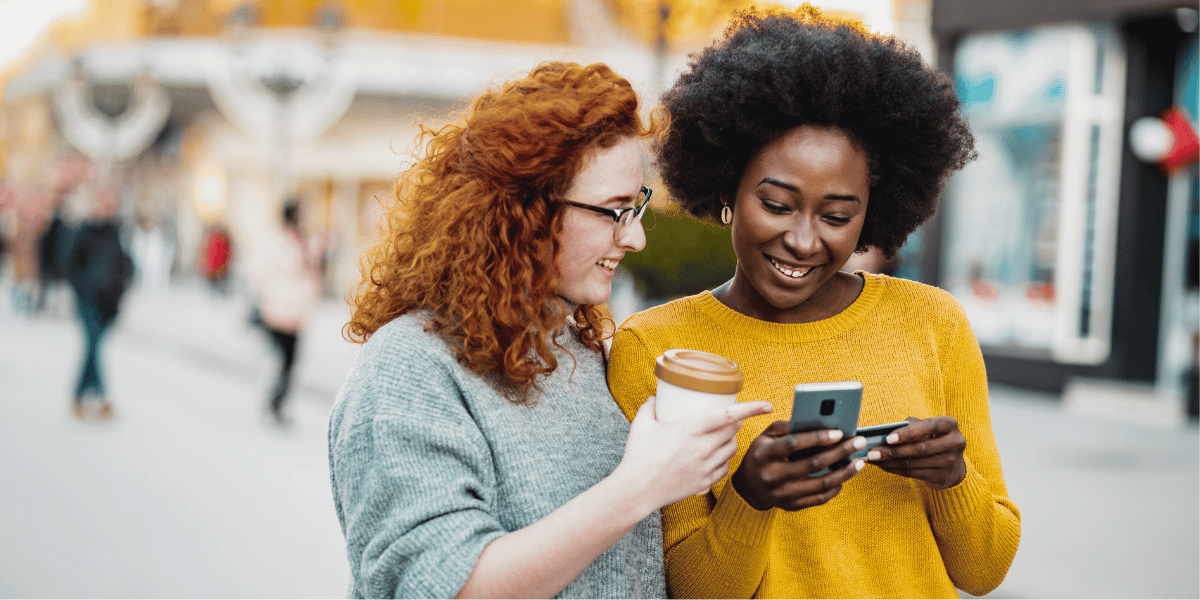 UK Business owners looking at phone preparing for the consumer law changes in 2026